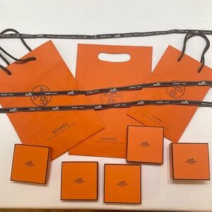 Empty Hermès bracelet boxes and bags